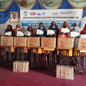 A group of fashion designing graduates who have successfully completed their skills training program.