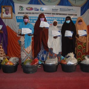 A group of liquid soap graduates who have successfully completed their skills training program.