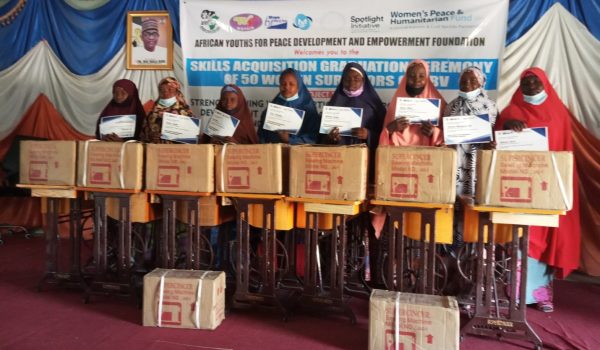 A group of fashion designing graduates who have successfully completed their skills training program.